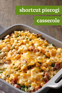 a casserole dish with meat and vegetables in it sitting on a striped cloth