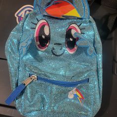 My Little Pony Rainbow Dash Mini Backpack. Tags Still Attatched Never Used Only Stored So Needs A Wipedown. Mlp Backpack, Mlp Accessories, Adam Sanders, Mlp Rainbow Dash, My Little Pony Backpack, Mlp Merch, My Little Pony Rainbow Dash, Pony Birthday, Face Icon