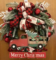 a christmas wreath with a red truck on it