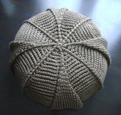 a knitted ball sitting on top of a table