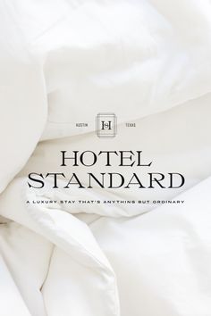 the hotel standard logo is on top of an unmade bed with white sheets and pillows