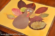 a turkey made out of leaves sitting on top of a yellow sheet of tissue paper