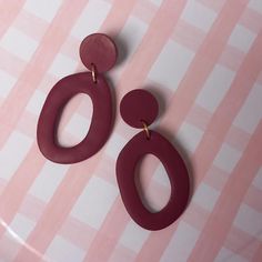 Burgundy coloured organic oval donut earrings handmade from polymer clay. On trend for autumn. With embedded stainless steel earring posts. Approx 5.5cm long Available in more colours. Check out my other items: https://www.houseofhettyj.etsy.com Burgundy Earrings, Donut Earrings, Autumn Earrings, Donuts Earrings, Clay Making, How To Make Clay, Block Colour, Oval Earrings, Fall Earrings