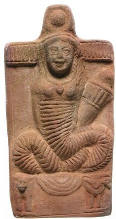 an ancient statue with a woman sitting on it's stomach and holding a cup