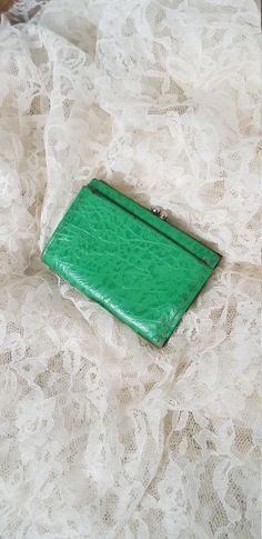 This charming Baronet Cowhide Wallet is in completely functional pre-loved condition. We love  the bright green of this piece. It is a rarely found color in leather and we have not found any others of this style in the same color. Measuring just at 3" × 4" closed it features an outer kisslock coin purse and a snap for the main closure. It does show some wear especially around the edges and the inside lining is discolored from use and age. We have included plenty of pictures for your review and p Cowhide Wallet, Have A Happy Day, Find Color, Change Purse, Money Clip Wallet, Trifold Wallet, Green Leather, Bright Green, Purse Wallet