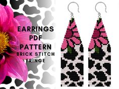 the earrings are made with pink flowers and black and white designs on them, along with an image of a flower