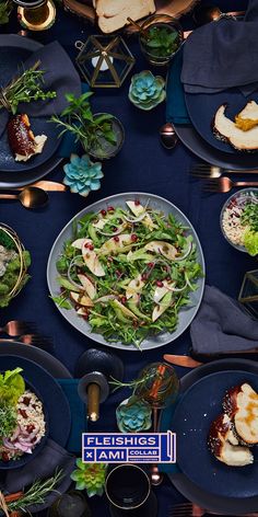 the table is set with many plates of food