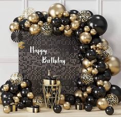 black and gold balloon arch with happy birthday message