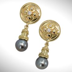 Set in 18K gold, these darkly glamorous Gothic-inspired earrings feature luxurious Tahitian black pearl drops and sparkling diamonds, embellished with exquisite gold granulation for an elegant and exquisite finish. Perfect for a night out spent in sophisticated style. 18KY granulated earrings with 2- 3mm VS/GH diamonds and 9mm Tahitian pearl drops.Dimensions: 1-3/8” x 9/16” (35mm x 16mm) Gold Tahitian Pearl Drop Earrings, Gold Tahitian Pearl Earrings For Anniversary, Elegant Gold Tahitian Pearl Earrings, Gold Tahitian Pearl Earrings For Formal Occasions, Black Pearl Earrings, Tahitian Black Pearls, Gothic Earrings, Tahitian Pearls, Black Pearl