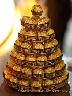 a stack of chocolate covered cookies sitting on top of a table