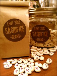 some cookies are sitting on a table next to a bag with the label sacrifice beans