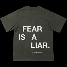 DETAILS This t-shirt is inspired by the call to overcome doubts and anxieties through Christ, reminding us that God’s truth is louder than fear’s lies. It's a daily reminder of the strength we have in Christ. Made from heavyweight 100% ring-spun cotton, this 6.1 oz./yd² tee offers comfort and durability. With double-needle stitching on the collar, sleeves, and hem, plus shoulder-to-shoulder taping, it’s built to last and perfect for everyday wear. Size Guide S M L XL 2XL Length (inches) 28 29 30 Back Of Shirt Design Ideas, Mens Christian Shirts, Simple T Shirts, Christian Shirt Designs, Christian Clothing Brands, Minimalist Tshirt Design, Church Tshirt, Church Shirt Designs, Christian Wear