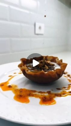 a white plate topped with food on top of a counter