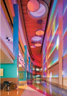 the interior of a building with colorful lighting