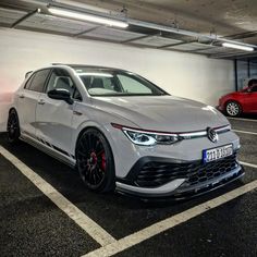 a white car parked in a parking garage