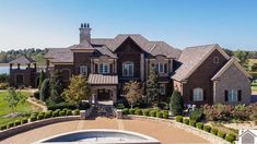 an aerial view of a large brick house