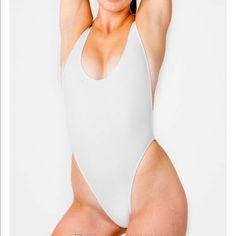 Never Worn But Does Not Have The Tags. The Iconic High Cut One-Piece Swimsuit Is Back In A Ribbed Nylon Elastane That Elongates Your Curves. This Style Features A Super High Rise On The Leg And Deep Side Openings With A Scoop Back. We Have Improved The Fit At The Sides For A More Secure Feeling. This Swimsuit Is Fully Lined And Perfect At The Pool, Beach Or Styled Like A Bodysuit In The Hotter Months Of The Year. Made By Experienced Seamstresses Earning Fair Wages In South Central, Los Angeles. Solid High Cut Bodysuit For Swimming, High Cut Summer Swimming Bodysuit, High Cut Bodysuit For Summer Swimming, High Cut Lined Bodysuit For Beach, Fitted High Cut White Swimwear, High Cut Beachwear Bodysuit For Pool, Beachwear High Cut Bodysuit For Pool, Summer High Cut Bodysuit For Poolside, Seamless High Cut Bodysuit For Beach