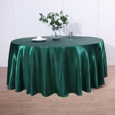 a round table with a green cloth on it