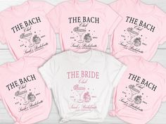 six pink shirts with the bride and groom's names printed on them, all in different styles