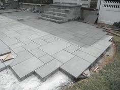 an outdoor patio being built with steps and pavers