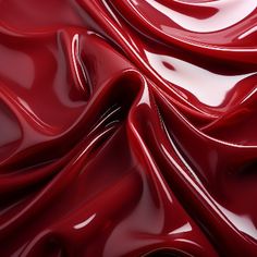 red liquid flowing down the side of a white surface, creating a wavy pattern on it's surface