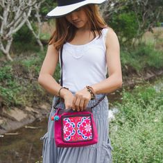 "This beautiful crossbody bag is made with an amazing hand embroidered piece of fabric by the Hmong hill tribes of Lanna Country (Northern Thailand). This bag is the perfect accessory to complete the look Great idea to grab your mini tablet, cell phone and your items in one stylish bag. adding convenience for your daily adventures. We buy materials from Hmong market and we design and sew by hand. Some of the bags we modify to improve the product. The Hmong tribes live in the North of Thailand an Multicolor Embroidery Crossbody Shoulder Bag, Pink Floral Embroidered Travel Bag, Pink Embroidered Crossbody Shoulder Bag, Multicolor Embroidery Bags For Gift, Sew By Hand, Pom Pom Bag, Boho Wallet, Artisan Bag, Boho Purse