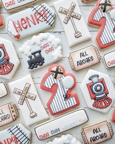 some cookies are decorated with train tracks and names on them for children's birthdays