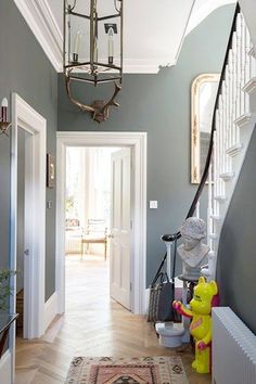 the hallway is clean and ready to be used as a playroom for children's toys