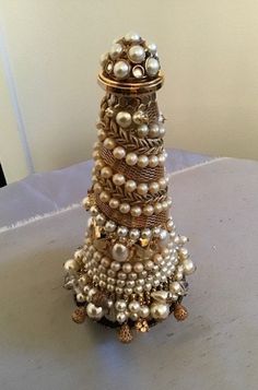 a small christmas tree made out of pearls