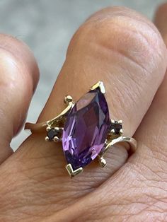 Vintage Amethyst Ring Fine jewelry  Star seller shop Over 600 pieces sold on Etsy Size 6 1/4 Gold plated pure silver ring and setting Beautiful yellow gold Stamped HRC ( Hanover Ring Company) Gorgeous amethyst stone Marquise cut amethyst stone measures 17 x 8 mm with a 3 mm depth 2 round amethyst stones each measure 2 mm February Birthstone  Beautiful ring! 1970-1980's ring Hand set by experienced jeweler  Fast and Free Shipping Vintage Amethyst Ring, Amethyst Cocktail Ring, February Birthstone Ring, Amethyst Ring Vintage, Jewelry Star, Amethyst Gold, Amethyst Jewelry, February Birthstone, February Birth Stone