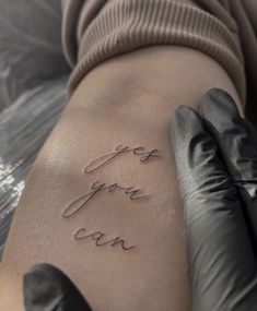 someone has written the words love you can on their arm and it looks like they are getting inked