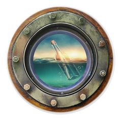 an image of a bottle floating in the ocean through a porthole on a ship