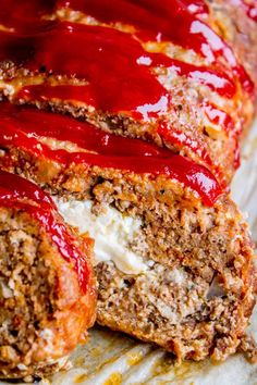 a meatloaf roll covered in ketchup and cheese