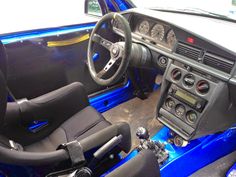 the interior of a car is blue and black