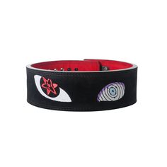 a black and red belt with an eye design on the front, two different colors