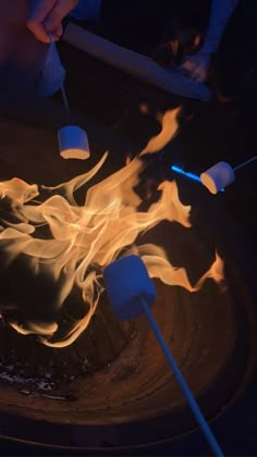 two marshmallows are being used to roast marshmallows