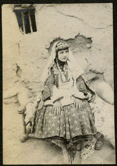 an old black and white photo of a woman