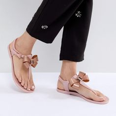 Step Into Holiday Mode With The Camaril Jelly Sandals. A Signature Ted Style, They Come With Looped Bow Detailing That’s Sure To Make Them The Prettiest Pair On The Beach. Never Worn Details: - Ted Baker Footwear Collection - Jelly - Bow Detail - Ted Baker-Branded - Buckle Fastening Care & Fabric: - Fabric Content: Upper: 100% Thermoplastic Polyurethane; Lining: 100% Thermoplastic Polyurethane; Sock: 100% Thermoplastic Polyurethane; Sole: 100% Thermoplastic -Polyurethane Trendy Pink Ankle Strap Sandals, Trendy Pink Open Heel Sandals, Feminine Closed Toe Summer Sandals, Feminine Closed Toe Sandals For Summer, Feminine Pink Round Toe Sandals, Pink Round Toe Slingback Sandals For Summer, Feminine Flat Heel Sandals For Spring, Feminine Closed Toe Beach Sandals, Feminine Flat Synthetic Sandals