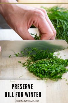 someone is cutting up some green herbs on a wooden board with the words preserve dill for winter