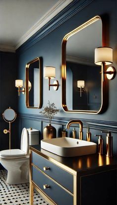 an elegant bathroom with blue walls and gold accents, including a large mirror above the sink