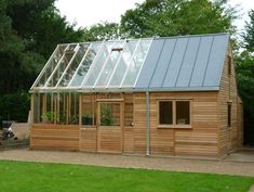 a small wooden house with a metal roof