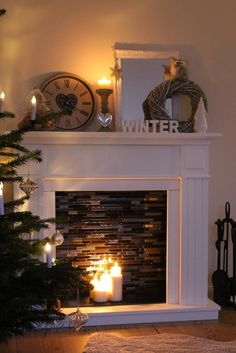 a living room with a fireplace decorated for christmas