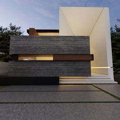 an exterior view of a modern house at dusk