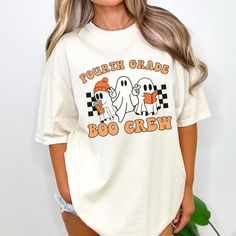 You will love this Halloween fourth grade crew shirt! This is the perfect trendy tee for fourth grade teachers and 4th grade teacher teams to wear during the fall/Halloween season and makes a great Halloween gift for new teachers! PRODUCTION TIME: 2-5 business days  SHIPPING TIME: 2-5 business days  PRODUCT DESCRIPTION: These ultra soft pigment dyed shirts are one of our best sellers, 100% Cotton. 100% ring spun cotton Preshrunk, soft-washed, garment-dyed fabric Set-in sleeves Double-needle stit Character Print Crew Neck Top For College, School Spirit Crew Neck T-shirt With Character Print, School Spirit T-shirt With Character Print, School Crew Neck T-shirt For Fall, Fun Crew Neck Tops For College, Crew Neck T-shirt For School In Fall, White T-shirt For School In Fall, Casual Fall T-shirt For School, Relaxed Fit T-shirt For School In Fall