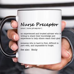 a person holding a coffee mug with the words nurse preceptor on it