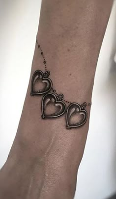 two hearts tattoo on the wrist