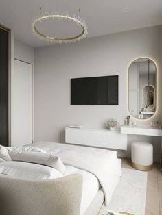 a bedroom with white furniture and a large mirror on the wall