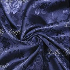 an image of a blue fabric with floral designs on it and the words, lily grad