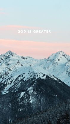 mountains covered in snow with the words god is greater above them