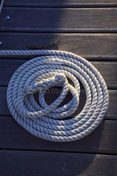 a rope on the ground next to a dock royalty images and stock photos for sale